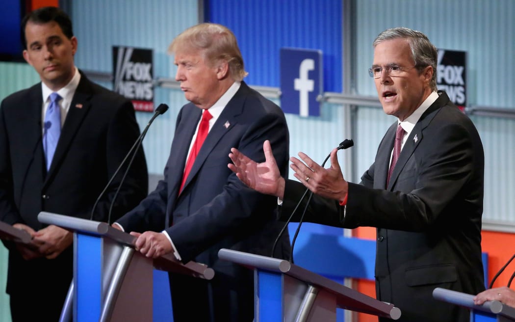 Republican presidential candidates (L-R) Wisconsin Gov. Scott Walker, Donald Trump and Jeb Bush in presidential debate in Cleveland, Ohio.