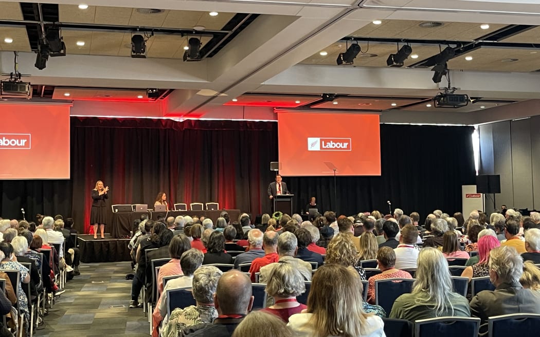 Incoming Labour Party president Jill Day and Labour finance spokesperson Grant Robertson on the podium at the Labour Party's 2022 annual conference.