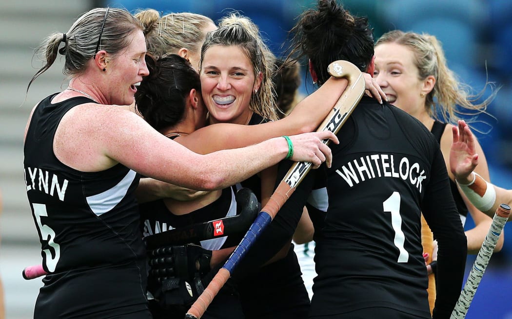 Jordan Grant is mobbed by teammates after scoring a goal during the bronze medal match between New Zealand and South Africa. Glasgow 2014 Commonwealth Games.