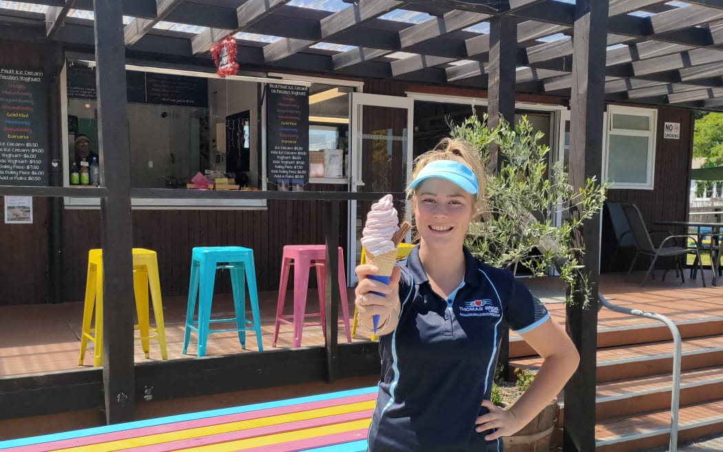 A Thomas Bros staff member with one of their popular real fruit ice creams