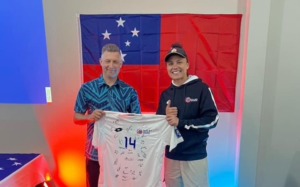 Ruby Tui presents the Samoan football shirts.