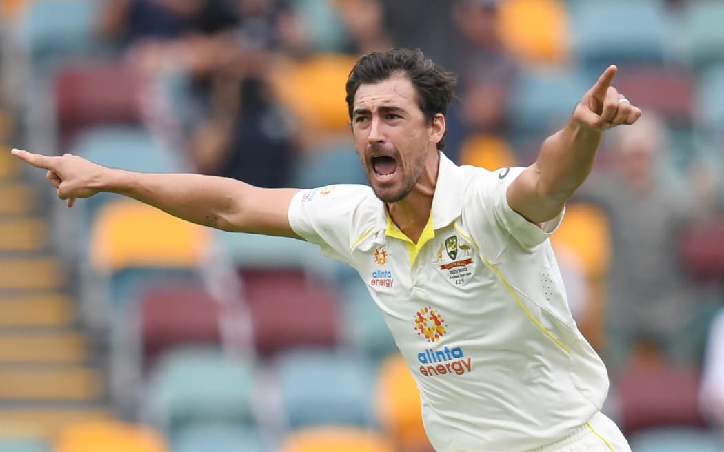 Mitchell Starc of Australia celebrates taking a wicket.