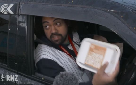 One of many fast food fans interviewed by media through the car window at the drive-thru on Tuesday.