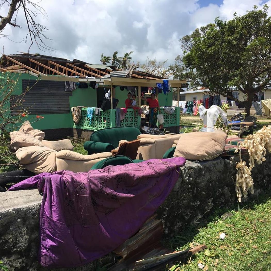 Most homes are damaged due to flooding and some families are drying their furniture while the sun is out — at Ma'ufanga.