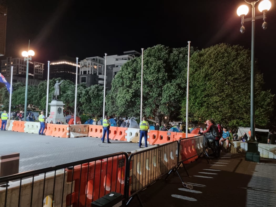 Police at the site of the protest at Parliament on Thursday night.