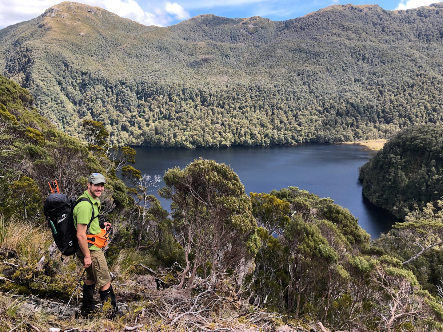 Tokoeka Kiwi researcher Tim Raemaekers, above Shy Lake, Fiordland National Park