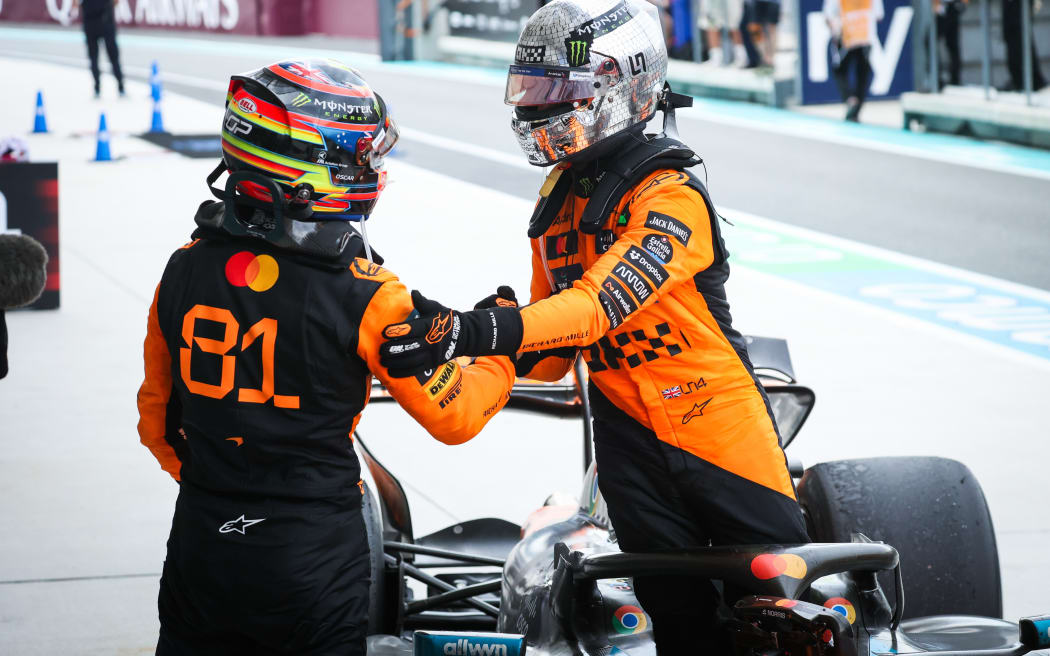 McLaren team-mates Oscar Piastri (L) and Lando Norris.