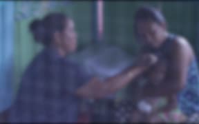 Samoan traditional healer Maria Amituanai treats patients with measles symptoms.