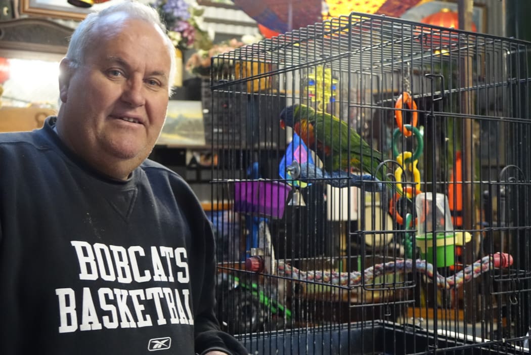 Local resident Stephen Parkes and his parrot, Darling.