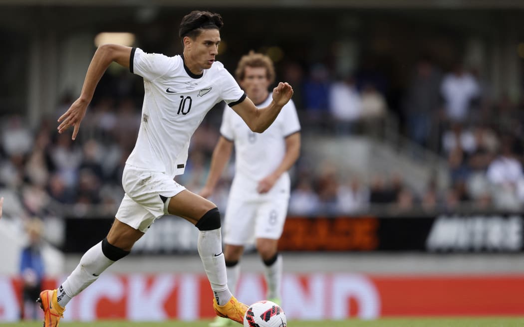 New Zealand’s Marko Stamenic runs with the ball during a friendly international football match between Australia and New Zealand at Eden Park in Auckland on September 25, 2022. (Photo by MICHAEL BRADLEY / AFP)