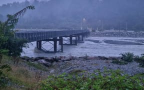 Waiho River near Franz Josef is murky and flowing swiftly as the region anticipates heavy rainfall on 19 January, 2024.