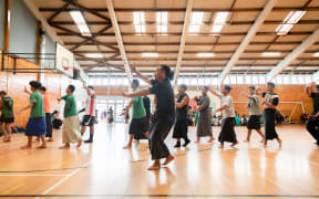 Seteone Tuli leads practice with the boys at Aorere College as they prepare for Polyfest.