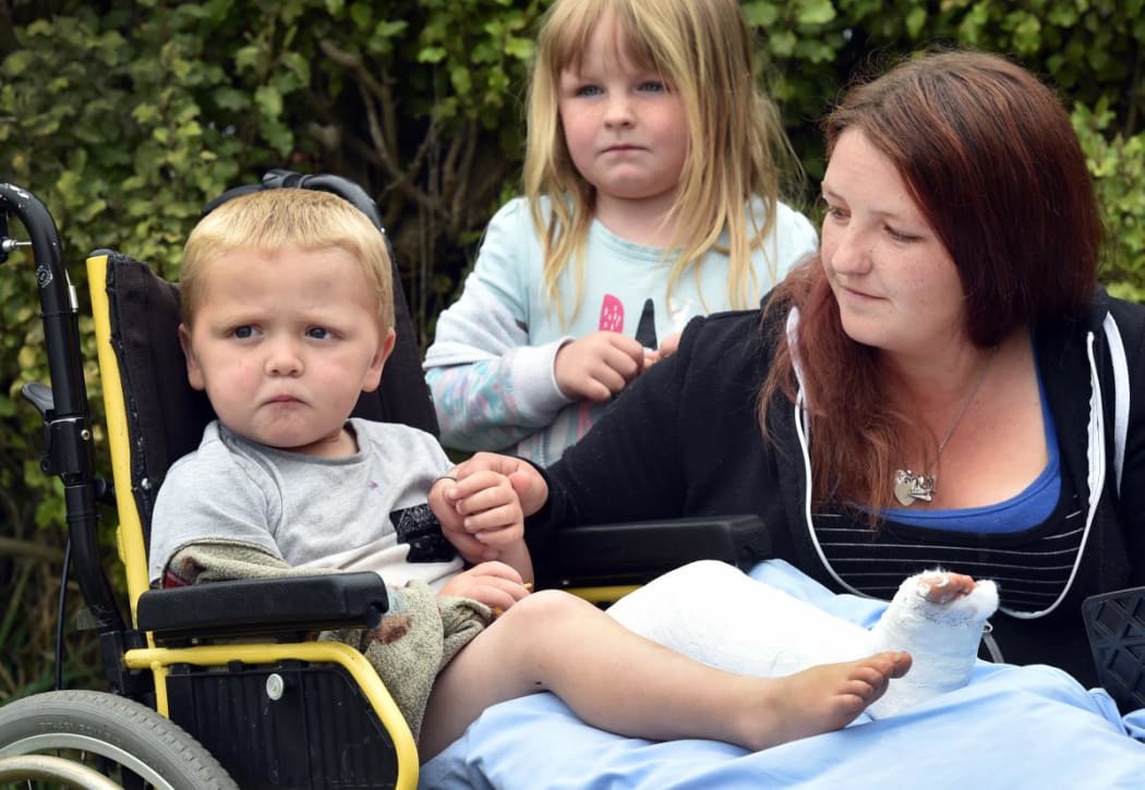 Pictured the day after a cyclist broke his leg in a hit-and-run in Dunedin is Jaxxyn (3), together with sister Hayley (5) and their mum Sonya Scott.