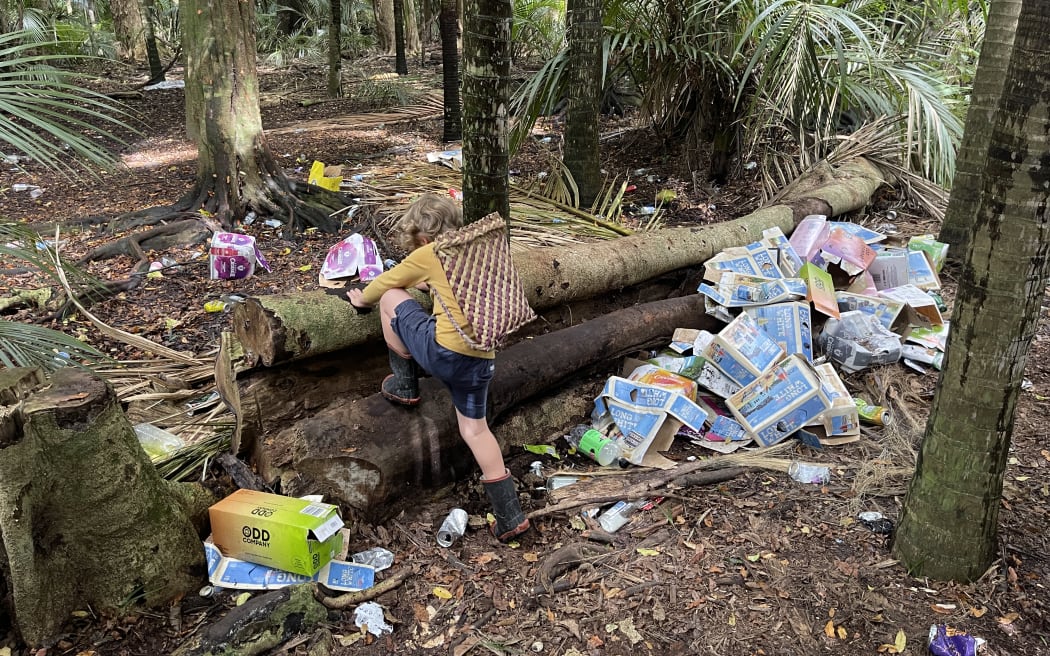 Sam Gibson and his three-year-old son Rehua (pictured) discovered the rubbish in Makauri Bush when they went to pick mushrooms.