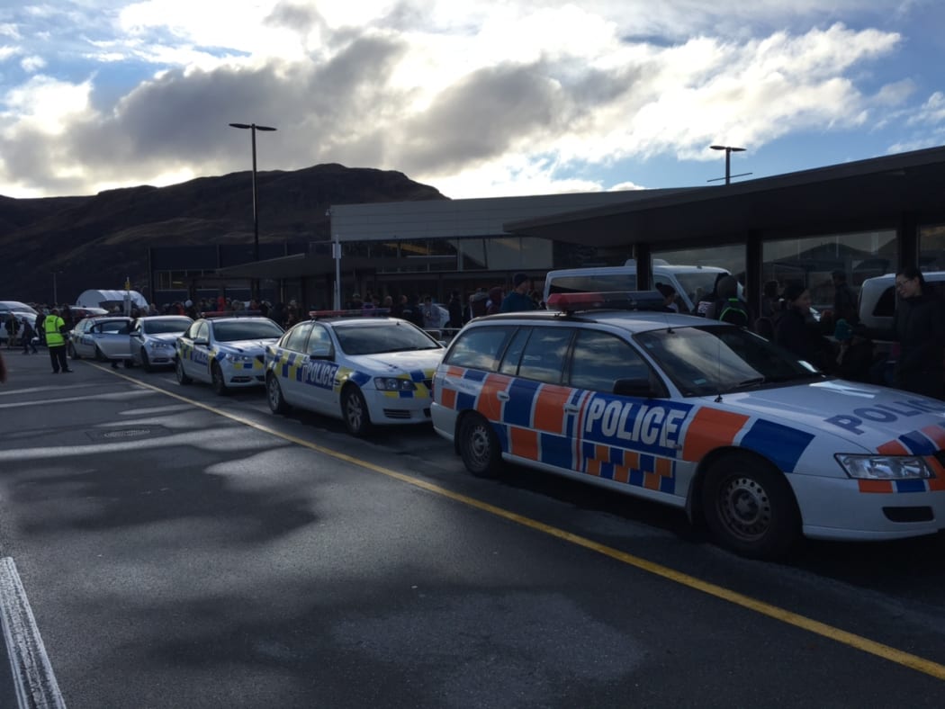 Police cars outside Queenstown airport after it was evacuated.