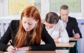 Students sitting an exam together