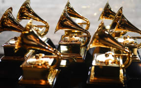 In this file photo taken on 28 January 2018, Grammy trophies sit in the press room during the 60th Annual Grammy Awards in New York.