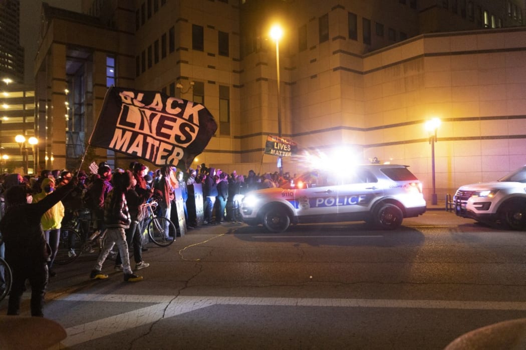 Black Lives Matter activists confront Columbus Police outside of Columbus Police headquarters during a protest in reaction to the shooting of Makiyah Bryant.