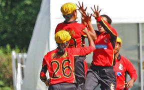 PNG celebrate a wicket against UAE at the World T20 Qualifiers.