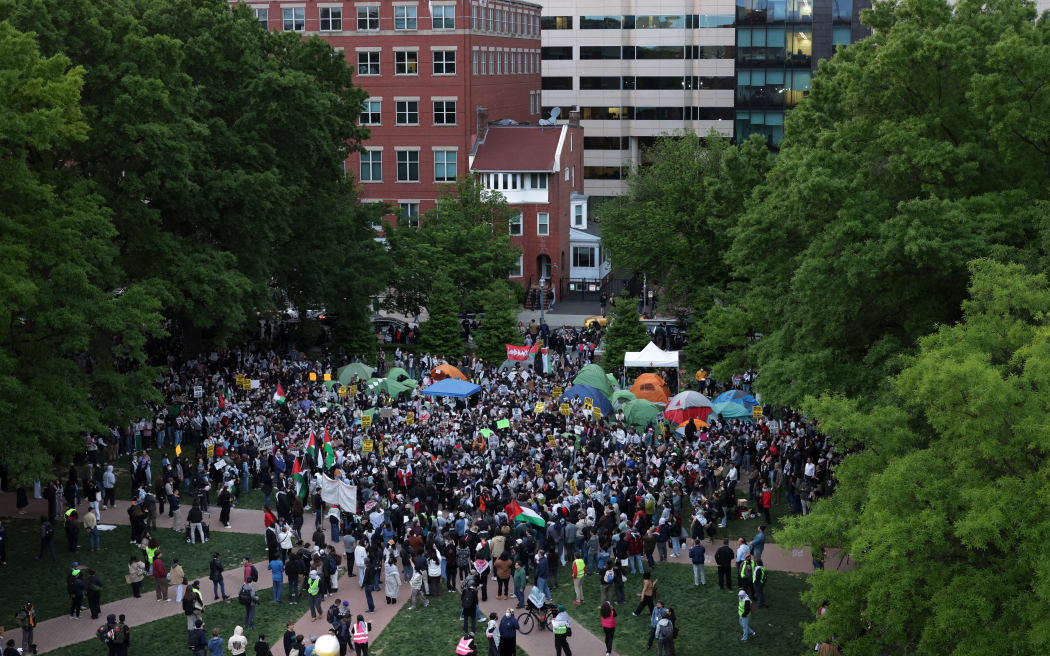 Activists and students participate in an encampment protest at the University Yard at George Washington University on April 25, 2024 in Washington, DC. Student Activists at George Washington University have joined a range of campuses across the United States who have started encampments to call on their universities to divest financial ties from Israel.