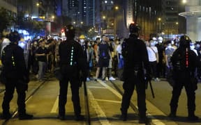 Young protesters block major roads in the financial district of Hong Kong on Wednesday June 12, 2019 to demand the withdrawal of the government sponsored China extradition bill.