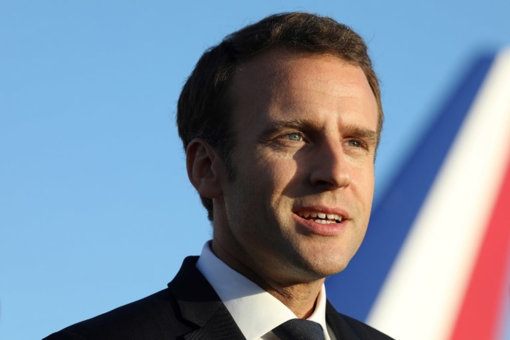 French President Emmanuel Macron speaks to the press upon his arrival at the airport in Noumea on May 3, 2018.