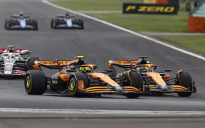 McLaren drivers Lando Norris (L) and Oscar Piastri.