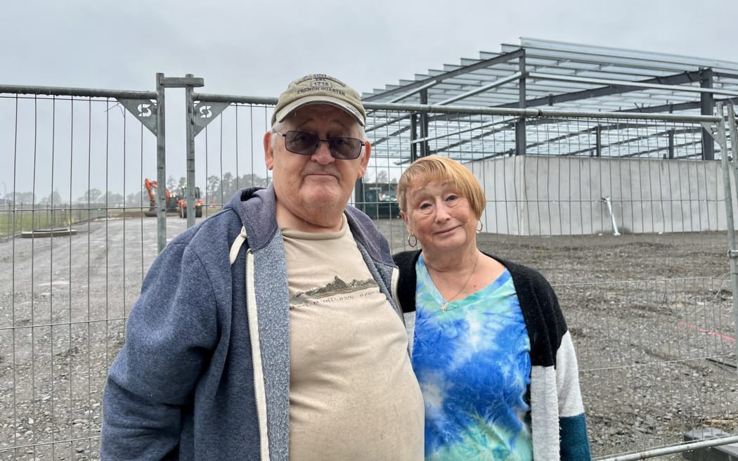 Dave McFarlane, left, and his partner Dorothy Lewis say the construction site near their property has been operating at all hours of the day.