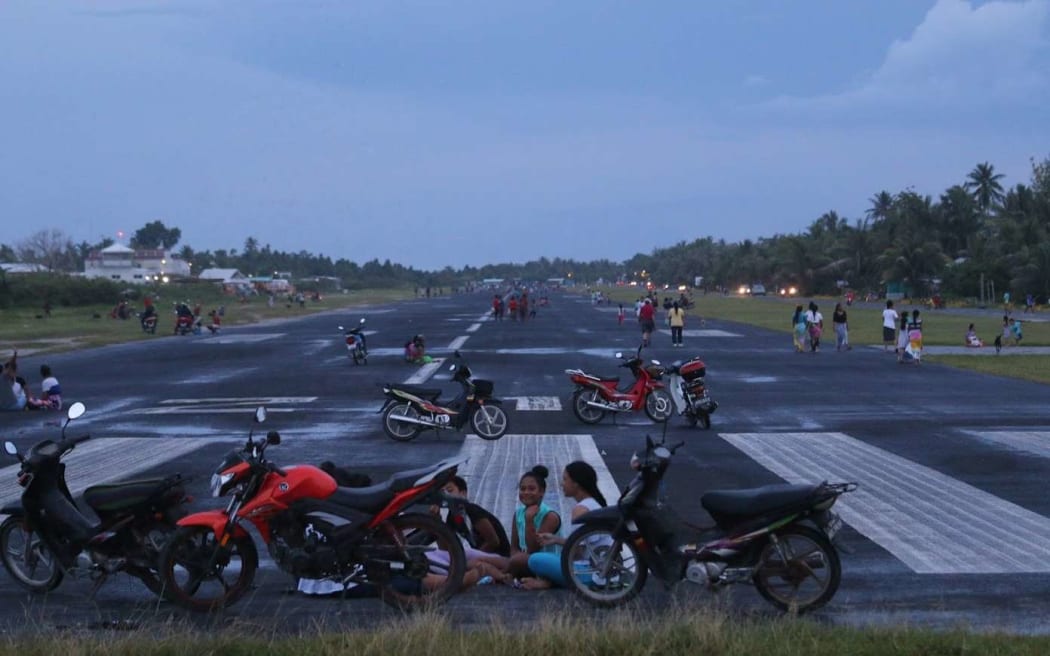 The runway at the airport in Funafuti, Tuvalu. With only three flights a week, the runway doubles as the small atoll's main recreation area.