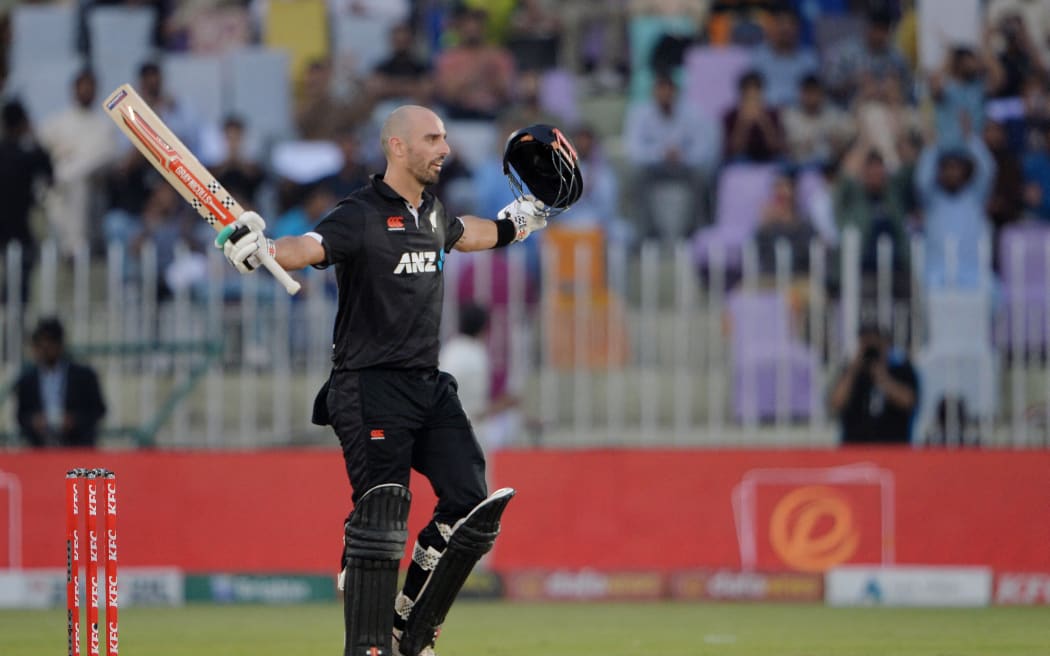 New Zealand's Daryl Mitchell celebrates after scoring a century (100 runs) during the second one-day international (ODI) cricket match between Pakistan and New Zealand at the Rawalpindi Cricket Stadium in Rawalpindi on April 29, 2023. (Photo by Farooq NAEEM / AFP)