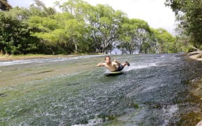 A photo posted in January 2014 shows a swimmer sliding down the Rere Rockslide, in Gisborme.