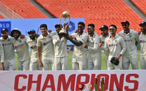 India's players pose with the Border-Gavaskar trophy after winning the series against Australia, 2023.