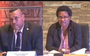 East Sepik Governor Allan Bird listens to Senior Magistrate Tracy Ganai at a Papua New Guinea Special Parliamentary Committee into Gender-based Violence.