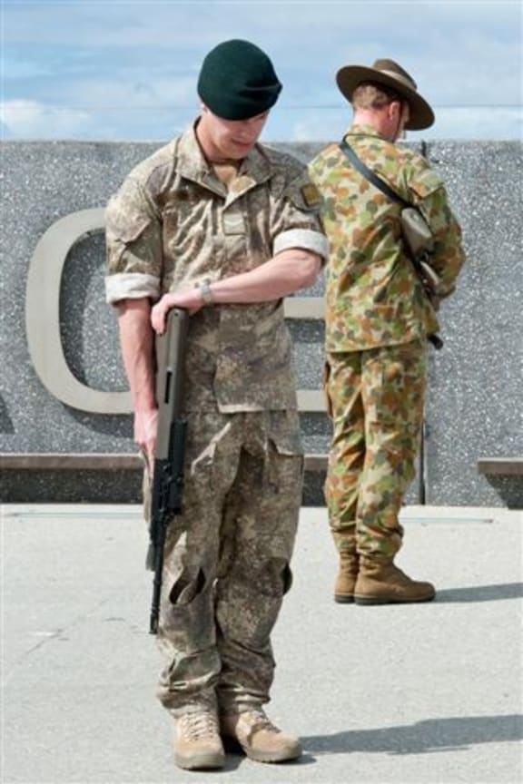 two soldiers stand on duty with heads bowed at WW1 commemoration in AlbanyT
