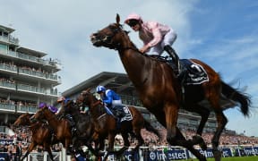 Jockey Seamie Heffernan rides Anthony Van Dyck (R) to victory in the Derby Stakes on the second day of the Epsom Derby Festival in Surrey, southern England on June 1, 2019