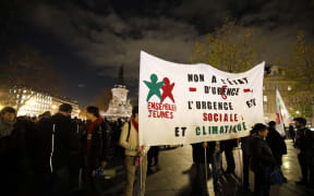 A protest in Paris on 26 November against the ban on public gatherings introduced after the attacks in the city. The banner reads "No to the state of emergency", "The emergency concerns social and climate issues".