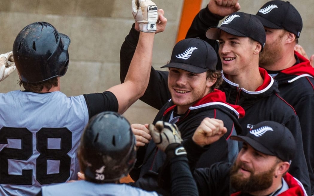 The Black Sox celebrate their tournament win.