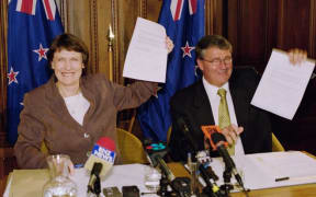 Labour leader and Prime Minister Helen Clark and Jim Anderton, leader of the coalition partner the Alliance, hold up their coalition agreement in 1999.