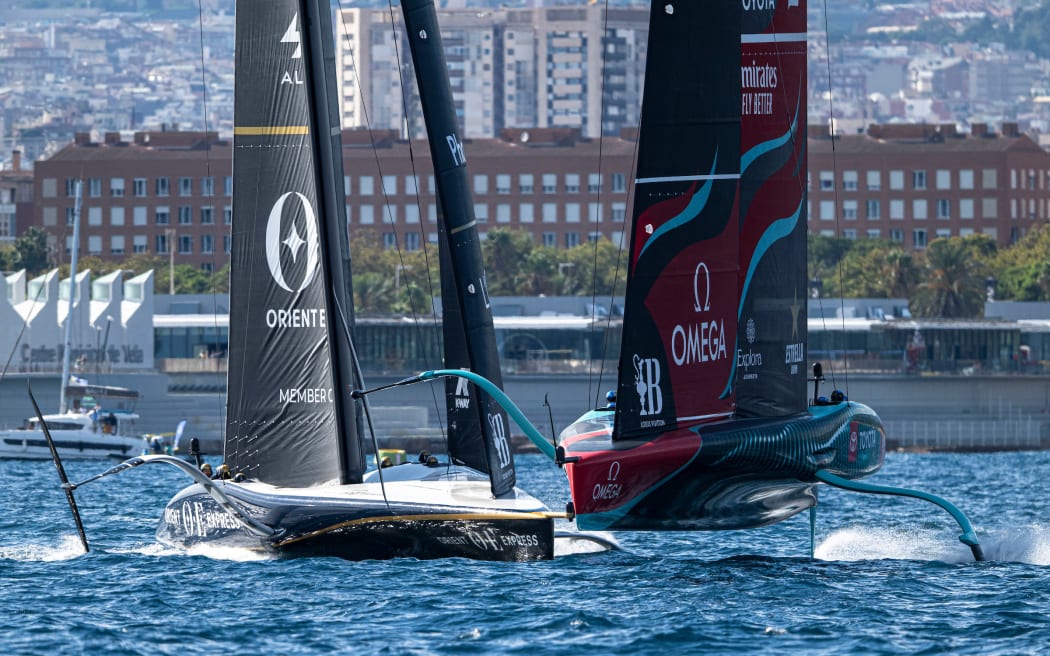 Orient Express (France) and Team New Zealand race off Barcelona, 2024.