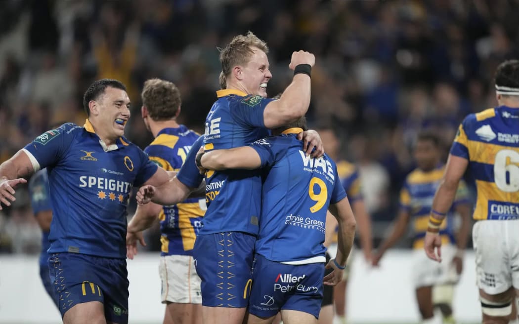 Sam Gilbert celebrates with Dylan Pledger.