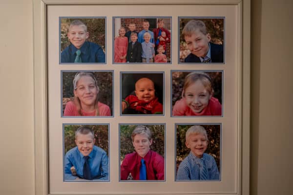 A frame with photos of Catherine Pakaluk's eight children.