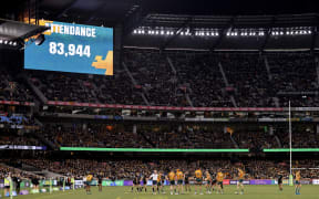 The official attendance is displayed on the big screen during the Rugby Championship and 2023 Bledisloe Cup match between Australia and New Zealand at Melbourne Cricket Ground in Melbourne on July 29, 2023. (Photo by Martin KEEP / AFP) / -- IMAGE RESTRICTED TO EDITORIAL USE - STRICTLY NO COMMERCIAL USE --