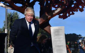 Boris Johnson in front of the Weta Workshop designed statue at the Pukeahu National War Memorial Park.