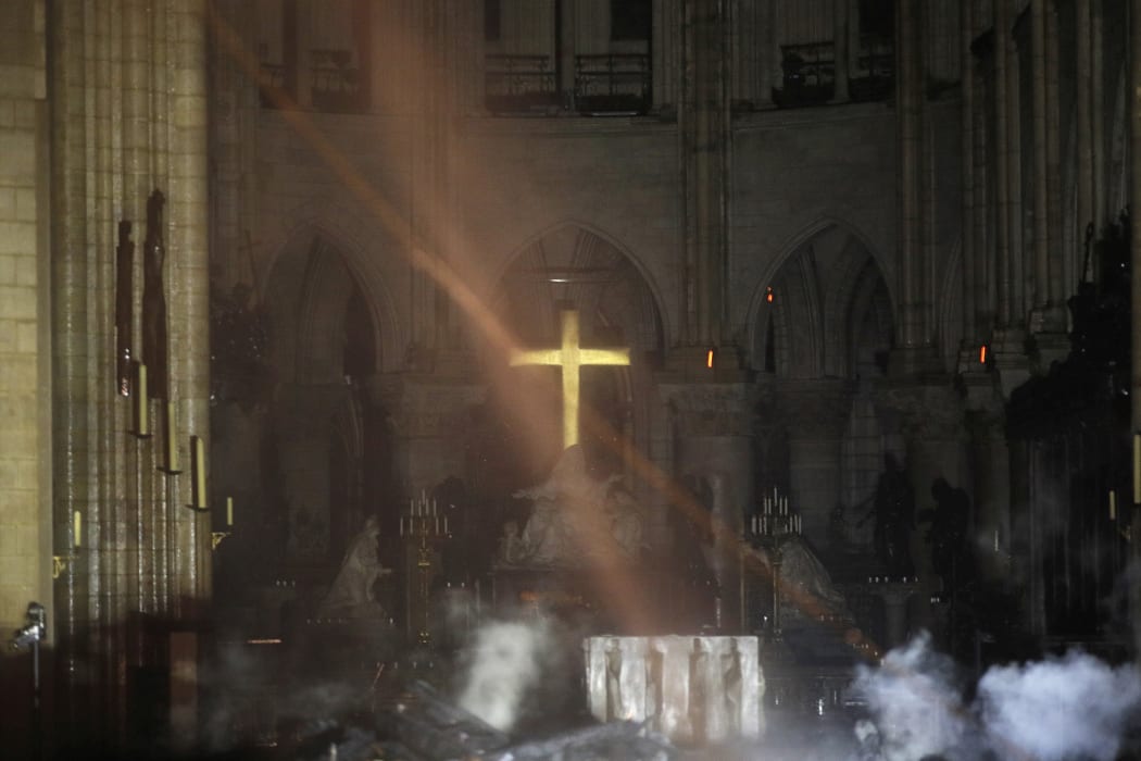 Smoke around the altar of Notre Dame cathedral in Paris/