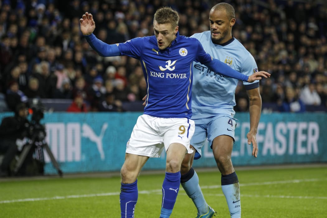 Jamie Vardy of Leicester City is challenged by Vincent Kompany of Manchester City, in December 2014.