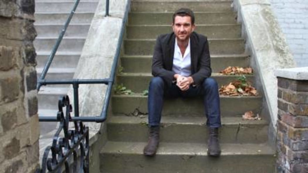 Chris Tubbs in front of his flat in Camden North London, 2011.