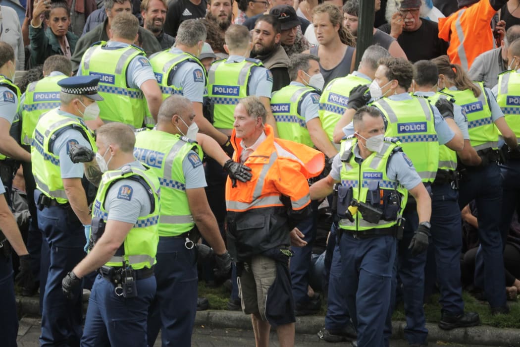 Police make multiple arrests in an effort to remove protesters occupying Parliament's precinct for a third day.