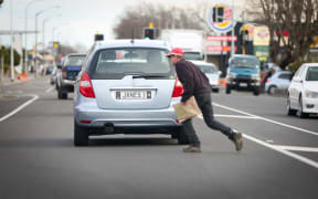 Pedestrian crossing the road in Levin.