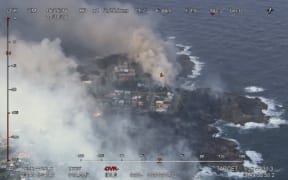 "The fire has burnt right to the coast in strong winds," the NSW Rural Fire Service tweeted.