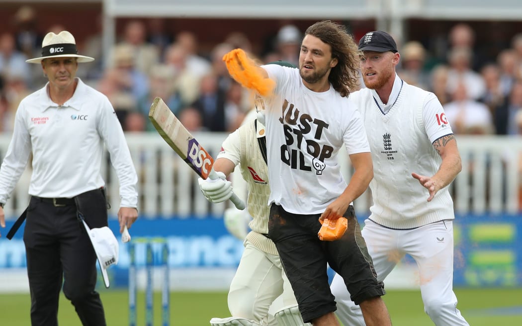 A Just Stop Oil protestor is stopped from going on the wicket by England captain Ben Stokes and David Warner the Australia batter
during the 2nd Ashes Test match Day 1 between England and Australia at Lord’s Cricket Ground, St.Johns Wood, London - 28/06/2023
© Matthew Impey / Wired Photos
Picture by Matt Impey +44 7789 130347